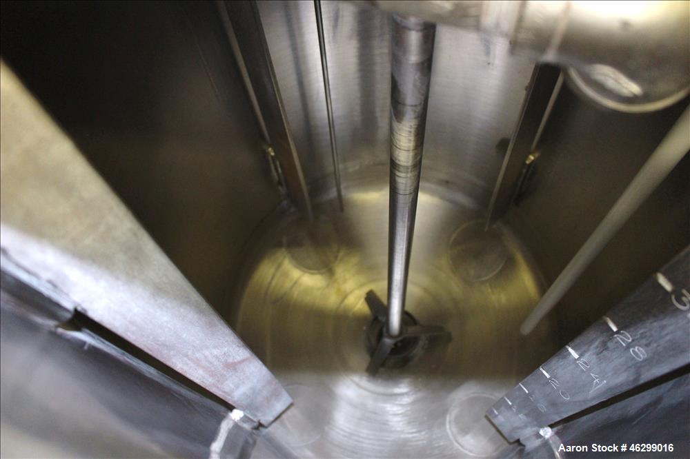 Used Tank, Approximately 40 Gallons, 304 Stainless Steel, Vertical. 20" Diameter x 30" straight side. Bolt-on flat top with 1/4 hinged cover, dished bottom. Top entering Lightnin agitator model XJC-3...