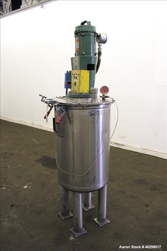 Used Tank, Approximately 40 Gallons, 304 Stainless Steel, Vertical. 20" Diameter x 30" straight side. Bolt-on flat top with 1/4 hinged cover, dished bottom. Top entering Lightnin agitator model XJC-3...