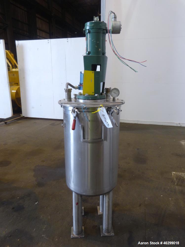 Used Tank, Approximately 40 Gallons, 304 Stainless Steel, Vertical. 20" Diameter x 30" straight side. Bolt-on flat top with 1/4 hinged cover, dished bottom. Top entering Lightnin agitator model XJC-3...