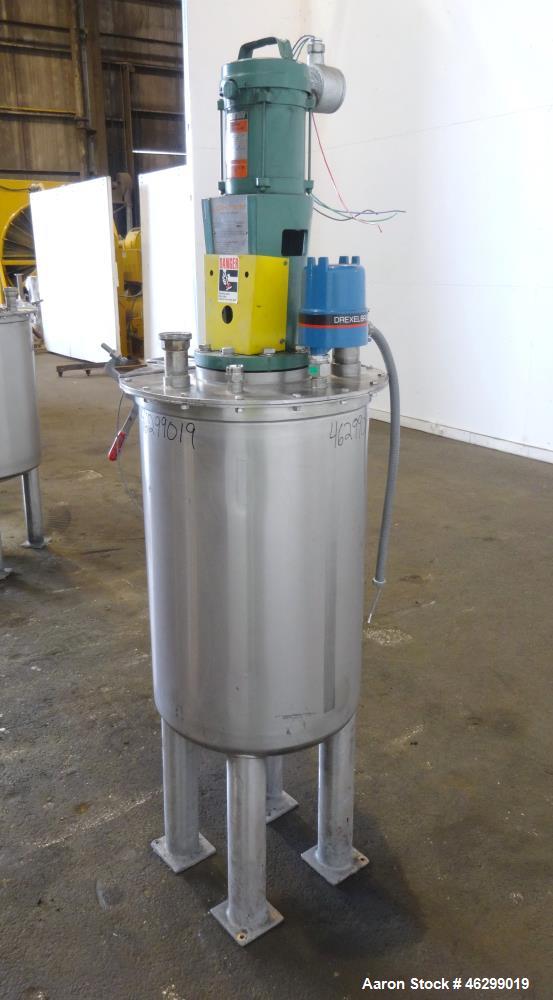 Used Tank, Approximately 40 Gallons, 304 Stainless Steel, Vertical. 20" Diameter x 30" straight side. Bolt-on flat top with 1/4 hinged cover, dished bottom. Top entering Lightnin agitator model XJC-3...