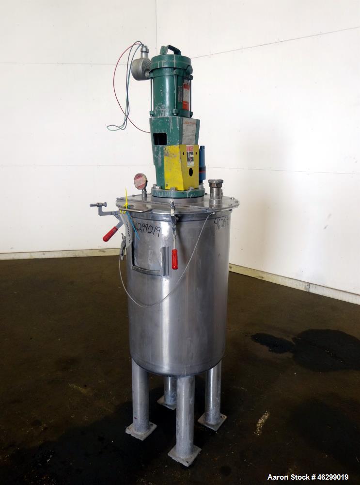 Used Tank, Approximately 40 Gallons, 304 Stainless Steel, Vertical. 20" Diameter x 30" straight side. Bolt-on flat top with 1/4 hinged cover, dished bottom. Top entering Lightnin agitator model XJC-3...