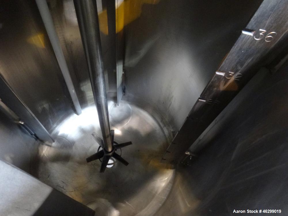 Used Tank, Approximately 40 Gallons, 304 Stainless Steel, Vertical. 20" Diameter x 30" straight side. Bolt-on flat top with 1/4 hinged cover, dished bottom. Top entering Lightnin agitator model XJC-3...