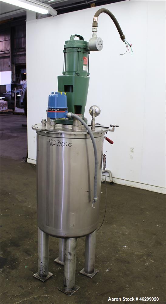 Used Tank, Approximately 40 Gallons, 304 Stainless Steel, Vertical. 20" Diameter x 30" straight side. Bolt-on flat top with 1/4 hinged cover, dished bottom. Top entering Lightnin agitator model XJC-3...