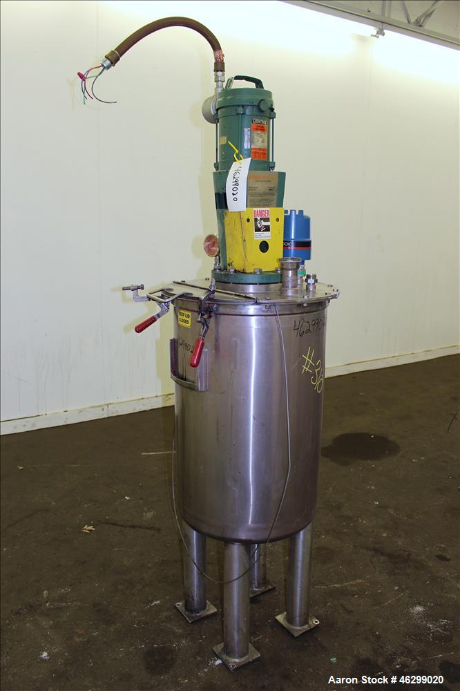 Used Tank, Approximately 40 Gallons, 304 Stainless Steel, Vertical. 20" Diameter x 30" straight side. Bolt-on flat top with 1/4 hinged cover, dished bottom. Top entering Lightnin agitator model XJC-3...