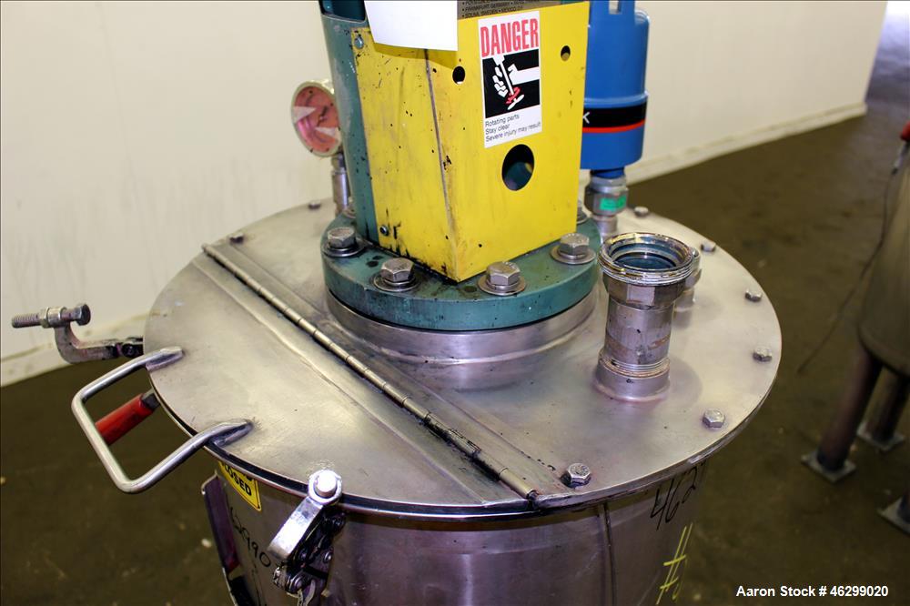 Used Tank, Approximately 40 Gallons, 304 Stainless Steel, Vertical. 20" Diameter x 30" straight side. Bolt-on flat top with 1/4 hinged cover, dished bottom. Top entering Lightnin agitator model XJC-3...