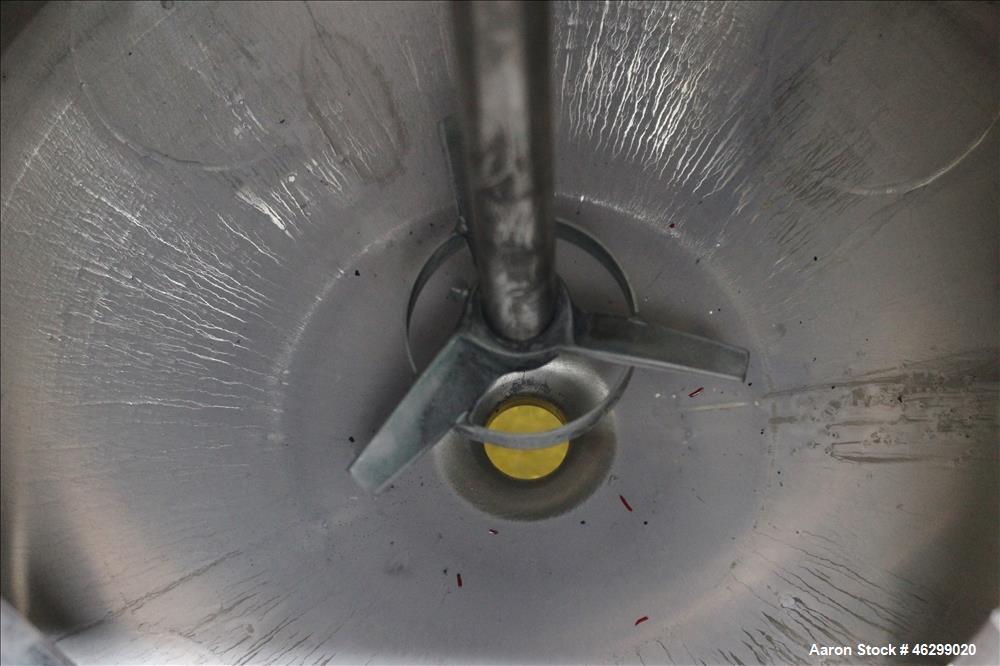 Used Tank, Approximately 40 Gallons, 304 Stainless Steel, Vertical. 20" Diameter x 30" straight side. Bolt-on flat top with 1/4 hinged cover, dished bottom. Top entering Lightnin agitator model XJC-3...