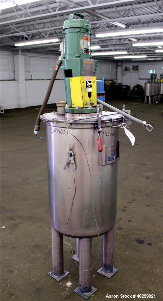 Used Tank, Approximately 40 Gallons, 304 Stainless Steel, Vertical. 20" Diameter x 30" straight side. Bolt-on flat top with 1/4 hinged cover, dished bottom. Top entering Lightnin agitator model XJC-3...