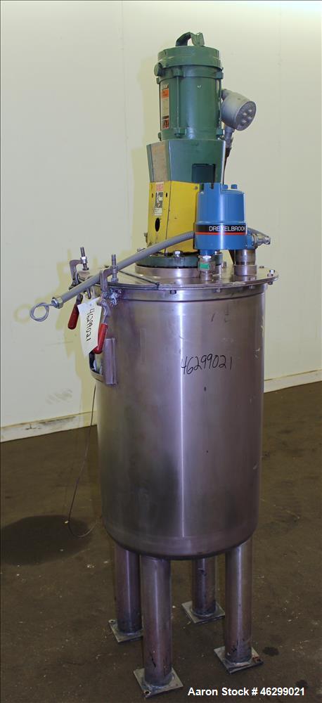 Used Tank, Approximately 40 Gallons, 304 Stainless Steel, Vertical. 20" Diameter x 30" straight side. Bolt-on flat top with 1/4 hinged cover, dished bottom. Top entering Lightnin agitator model XJC-3...