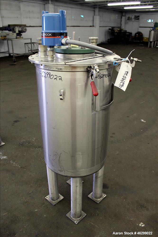 Used Tank, Approximately 40 Gallons, 304 Stainless Steel, Vertical. 20" Diameter x 30" straight side. Bolt-on flat top with 1/4 hinged cover, dished bottom. Top entering agitator (no motor), with 1" ...