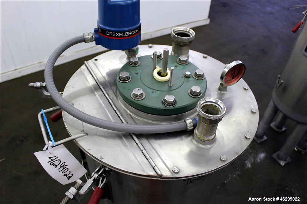 Used Tank, Approximately 40 Gallons, 304 Stainless Steel, Vertical. 20" Diameter x 30" straight side. Bolt-on flat top with 1/4 hinged cover, dished bottom. Top entering agitator (no motor), with 1" ...