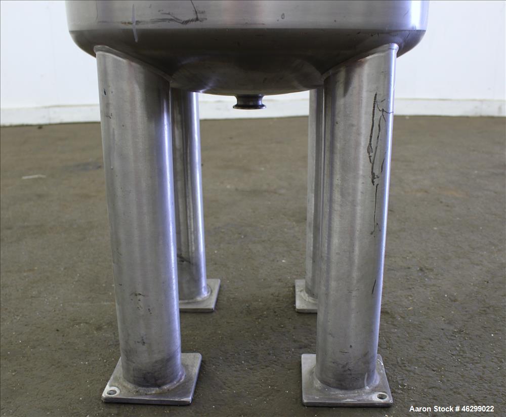 Used Tank, Approximately 40 Gallons, 304 Stainless Steel, Vertical. 20" Diameter x 30" straight side. Bolt-on flat top with 1/4 hinged cover, dished bottom. Top entering agitator (no motor), with 1" ...
