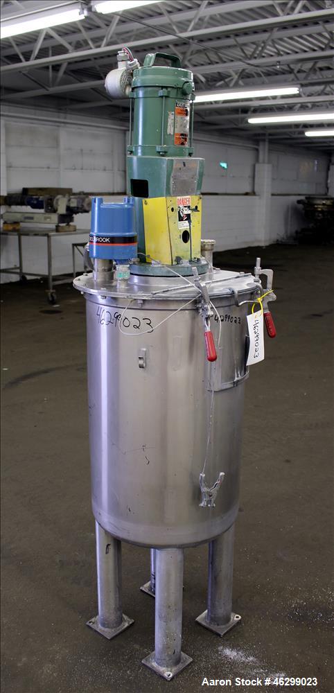 Used Tank, Approximately 40 Gallons, 304 Stainless Steel, Vertical. 20" Diameter x 30" straight side. Bolt-on flat top with 1/4 hinged cover, dished bottom. Top entering Lightnin agitator model XJC-3...