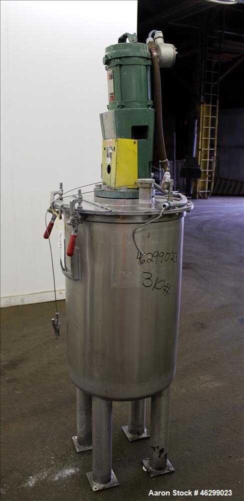 Used Tank, Approximately 40 Gallons, 304 Stainless Steel, Vertical. 20" Diameter x 30" straight side. Bolt-on flat top with 1/4 hinged cover, dished bottom. Top entering Lightnin agitator model XJC-3...