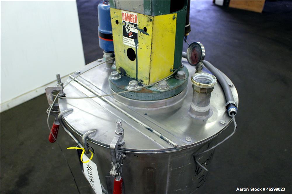 Used Tank, Approximately 40 Gallons, 304 Stainless Steel, Vertical. 20" Diameter x 30" straight side. Bolt-on flat top with 1/4 hinged cover, dished bottom. Top entering Lightnin agitator model XJC-3...