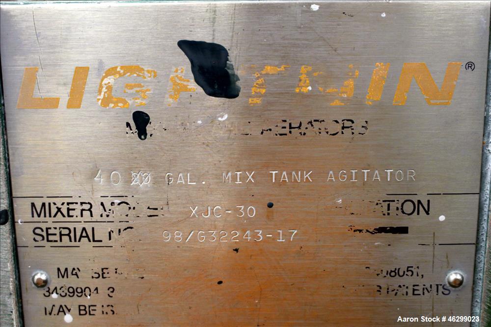 Used Tank, Approximately 40 Gallons, 304 Stainless Steel, Vertical. 20" Diameter x 30" straight side. Bolt-on flat top with 1/4 hinged cover, dished bottom. Top entering Lightnin agitator model XJC-3...