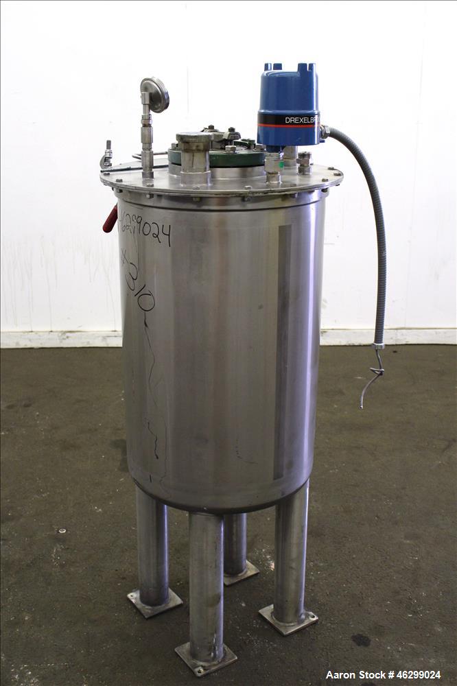 Used Tank, Approximately 40 Gallons, 304 Stainless Steel, Vertical. 20" Diameter x 30" straight side. Bolt-on flat top with 1/4 hinged cover, dished bottom. Top entering agitator (no motor), with 1" ...