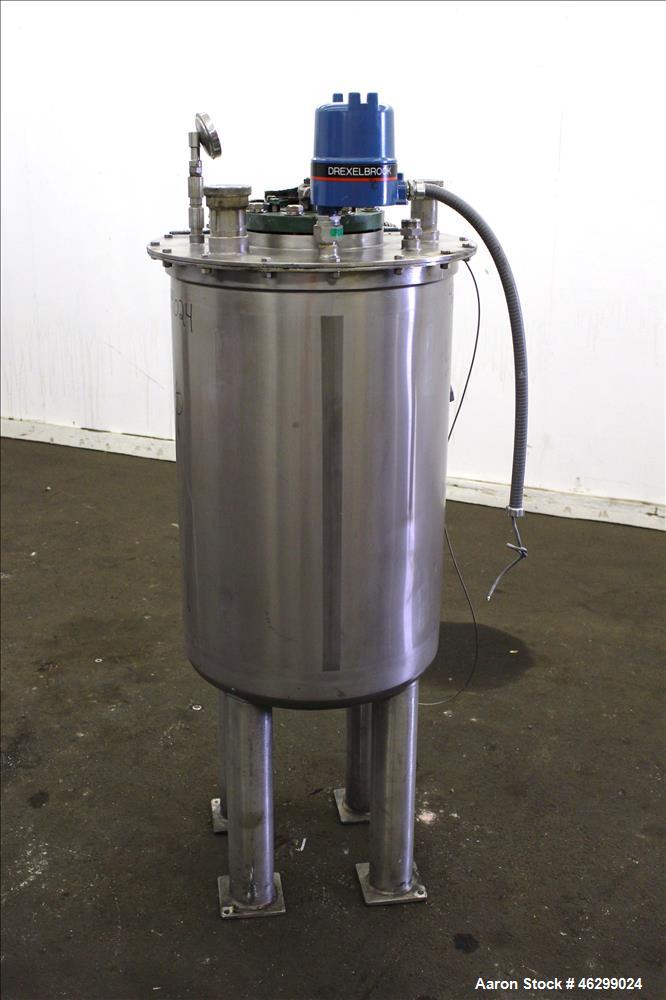 Used Tank, Approximately 40 Gallons, 304 Stainless Steel, Vertical. 20" Diameter x 30" straight side. Bolt-on flat top with 1/4 hinged cover, dished bottom. Top entering agitator (no motor), with 1" ...