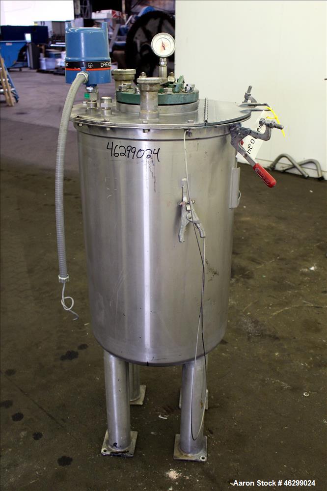 Used Tank, Approximately 40 Gallons, 304 Stainless Steel, Vertical. 20" Diameter x 30" straight side. Bolt-on flat top with 1/4 hinged cover, dished bottom. Top entering agitator (no motor), with 1" ...