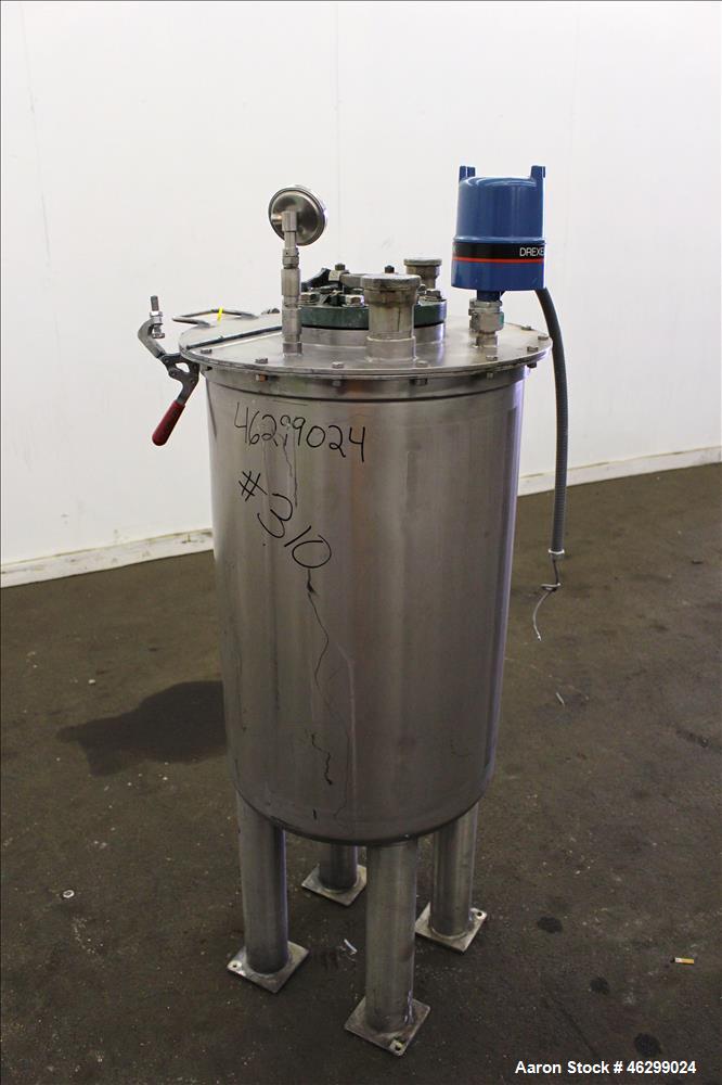 Used Tank, Approximately 40 Gallons, 304 Stainless Steel, Vertical. 20" Diameter x 30" straight side. Bolt-on flat top with 1/4 hinged cover, dished bottom. Top entering agitator (no motor), with 1" ...