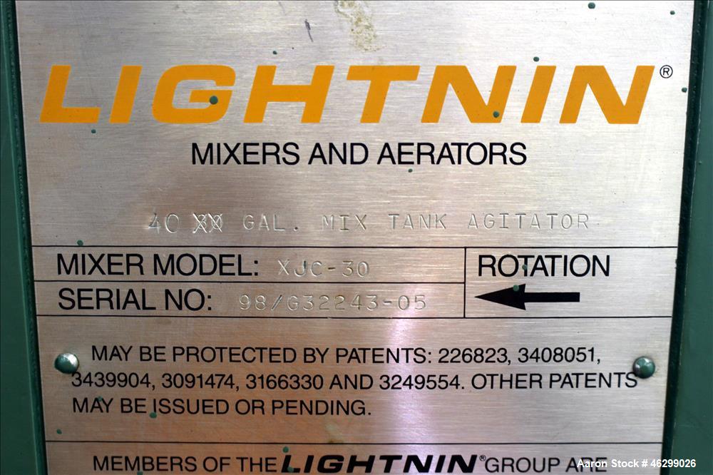 Used Tank, Approximately 40 Gallons, 304 Stainless Steel, Vertical. 20" Diameter x 30" straight side. Bolt-on flat top with 1/4 hinged cover, dished bottom. Top entering Lightnin agitator model XJC-3...