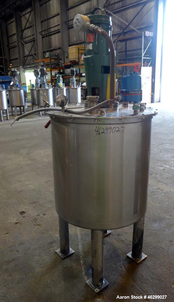 Used Tank, Approximately 80 Gallons, 304 Stainless Steel, Vertical. 30" Diameter x 28" straight side. Bolt-on flat top with 1/3 hinged cover, dished bottom. Top entering Lightnin agitator model XJC-3...