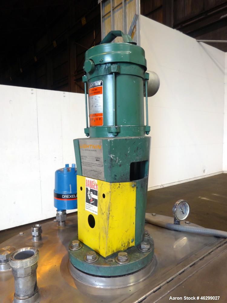 Used Tank, Approximately 80 Gallons, 304 Stainless Steel, Vertical. 30" Diameter x 28" straight side. Bolt-on flat top with 1/3 hinged cover, dished bottom. Top entering Lightnin agitator model XJC-3...