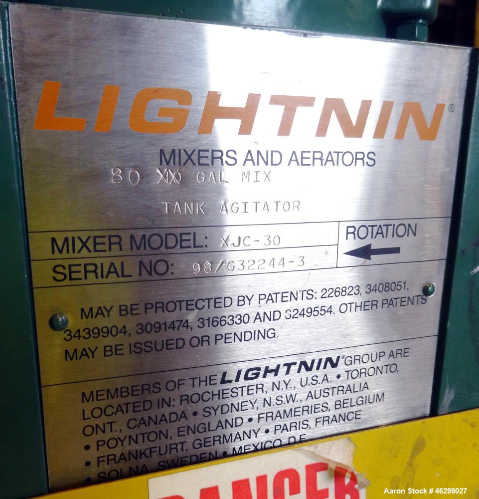 Used Tank, Approximately 80 Gallons, 304 Stainless Steel, Vertical. 30" Diameter x 28" straight side. Bolt-on flat top with 1/3 hinged cover, dished bottom. Top entering Lightnin agitator model XJC-3...