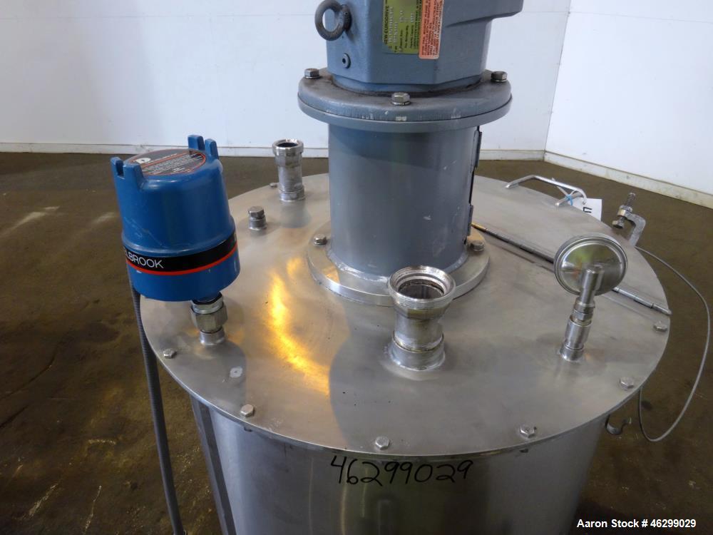 Used Tank, Approximately 80 Gallons, 304 Stainless Steel, Vertical. 30" Diameter x 28" straight side. Bolt-on flat top with 1/3 hinged cover, dished bottom. Top entering agitator, with 2" diameter sh...