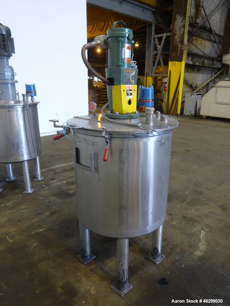Used Tank, Approximately 80 Gallons, 304 Stainless Steel, Vertical. 30" Diameter x 28" straight side. Bolt-on flat top with 1/3 hinged cover, dished bottom. Top entering Lightnin agitator model XJC-3...