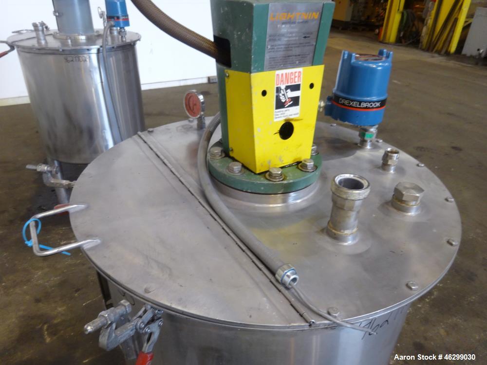 Used Tank, Approximately 80 Gallons, 304 Stainless Steel, Vertical. 30" Diameter x 28" straight side. Bolt-on flat top with 1/3 hinged cover, dished bottom. Top entering Lightnin agitator model XJC-3...