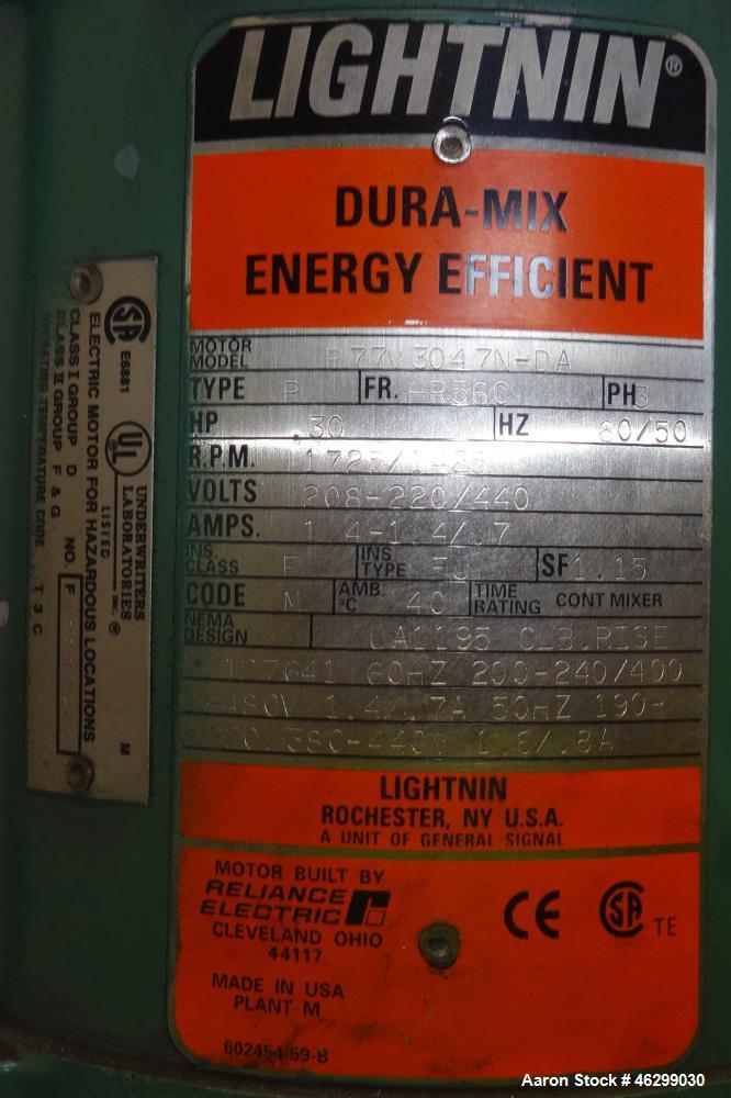 Used Tank, Approximately 80 Gallons, 304 Stainless Steel, Vertical. 30" Diameter x 28" straight side. Bolt-on flat top with 1/3 hinged cover, dished bottom. Top entering Lightnin agitator model XJC-3...