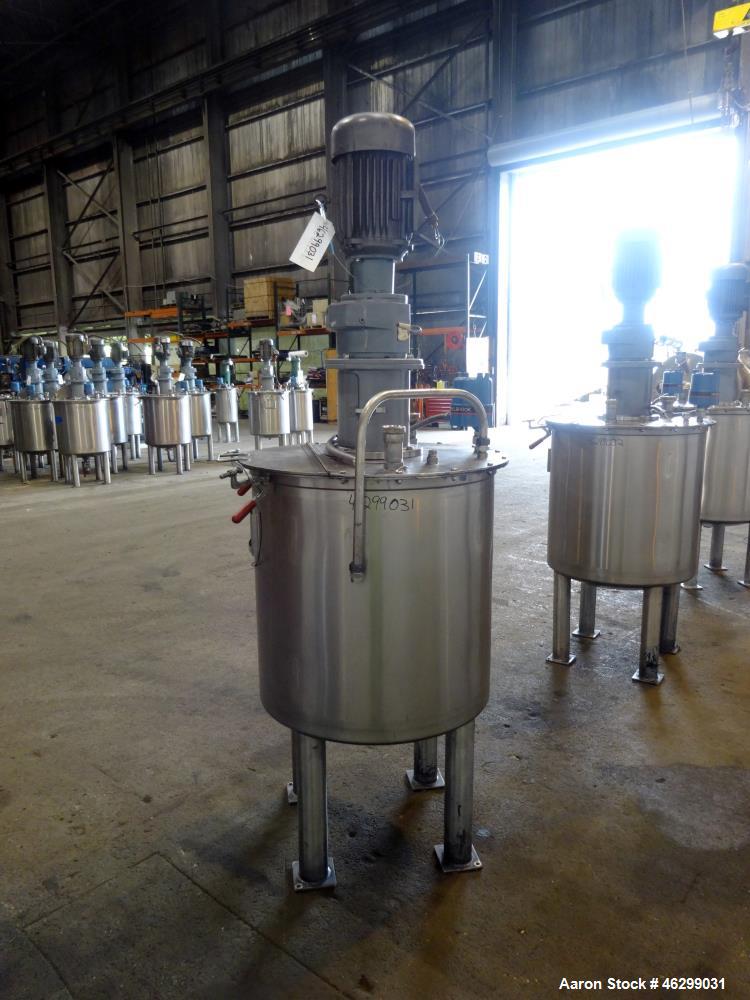 Used Tank, Approximately 80 Gallons, 304 Stainless Steel, Vertical. 30" Diameter x 28" straight side. Bolt-on flat top with 1/3 hinged cover, dished bottom. Top entering agitator, with 2" diameter sh...