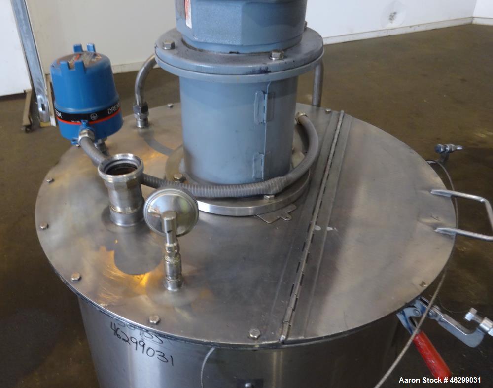 Used Tank, Approximately 80 Gallons, 304 Stainless Steel, Vertical. 30" Diameter x 28" straight side. Bolt-on flat top with 1/3 hinged cover, dished bottom. Top entering agitator, with 2" diameter sh...