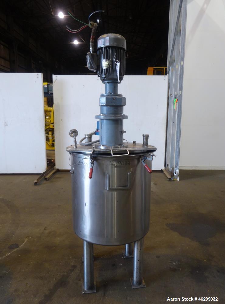 Used Tank, Approximately 80 Gallons, 304 Stainless Steel, Vertical. 30" Diameter x 28" straight side. Bolt-on flat top with 1/3 hinged cover, dished bottom. Top entering agitator, with 2" diameter sh...