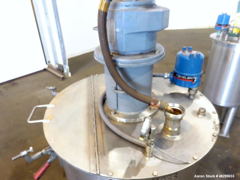 Used Tank, Approximately 80 Gallons, 304 Stainless Steel, Vertical. 30" Diameter x 28" straight side. Bolt-on flat top with 1/3 hinged cover, dished bottom. Top entering agitator, with 2" diameter sh...