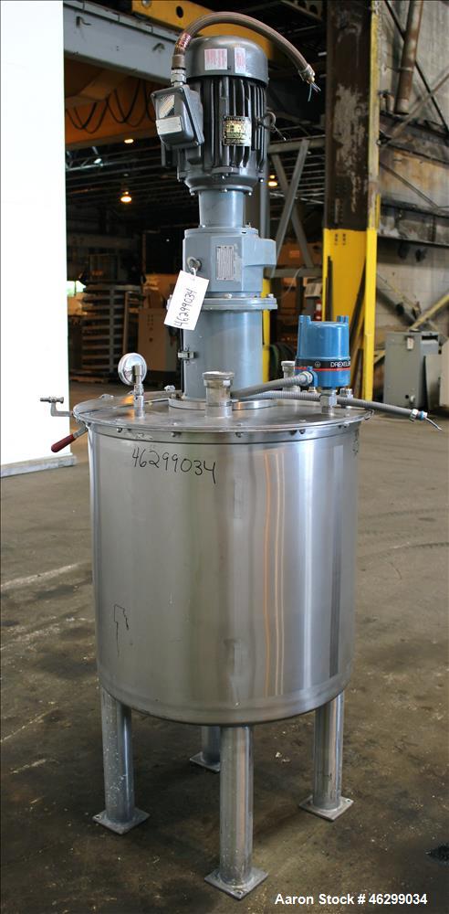 Used Tank, Approximately 80 Gallons, 304 Stainless Steel, Vertical. 30" Diameter x 28" straight side. Bolt-on flat top with 1/3 hinged cover, dished bottom. Top entering agitator, with 2" diameter sh...