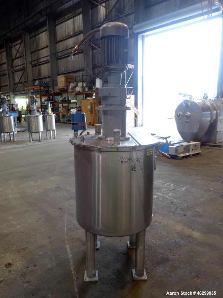Used Tank, Approximately 80 Gallons, 304 Stainless Steel, Vertical. 30" Diameter x 28" straight side. Bolt-on flat top with 1/3 hinged cover, dished bottom. Top entering agitator, with 2" diameter sh...