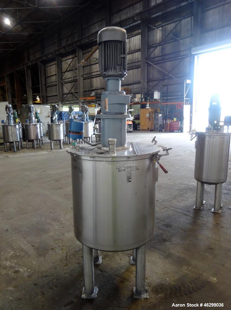 Used Tank, Approximately 80 Gallons, 304 Stainless Steel, Vertical. 30" Diameter x 28" straight side. Bolt-on flat top with 1/3 hinged cover, dished bottom. Top entering agitator, with 2" diameter sh...