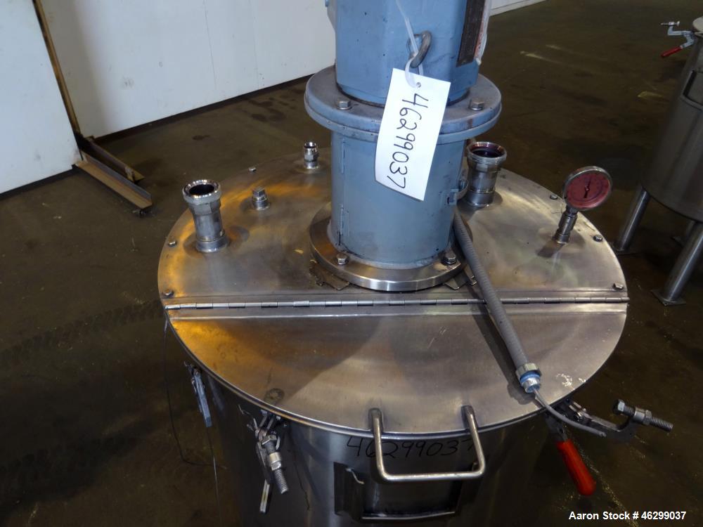 Used Tank, Approximately 80 Gallons, 304 Stainless Steel, Vertical. 30" Diameter x 28" straight side. Bolt-on flat top with 1/3 hinged cover, dished bottom. Top entering agitator, with 2" diameter sh...