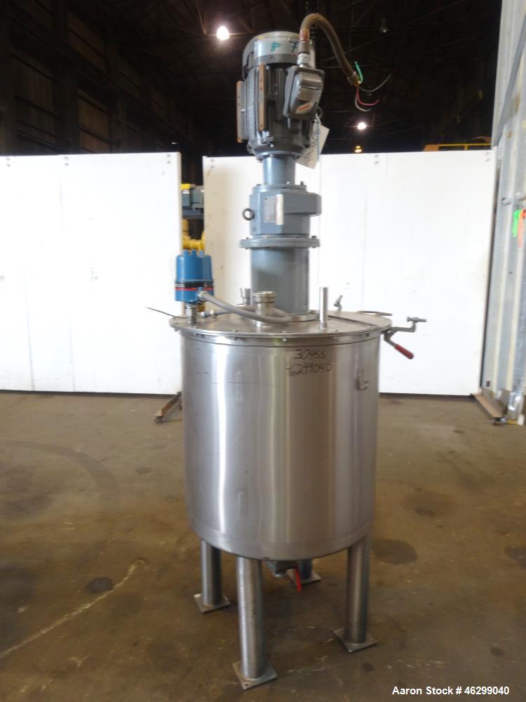 Used Tank, Approximately 80 Gallons, 304 Stainless Steel, Vertical. 30" Diameter x 28" straight side. Bolt-on flat top with 1/3 hinged cover, dished bottom. Top entering agitator, with 2" diameter sh...