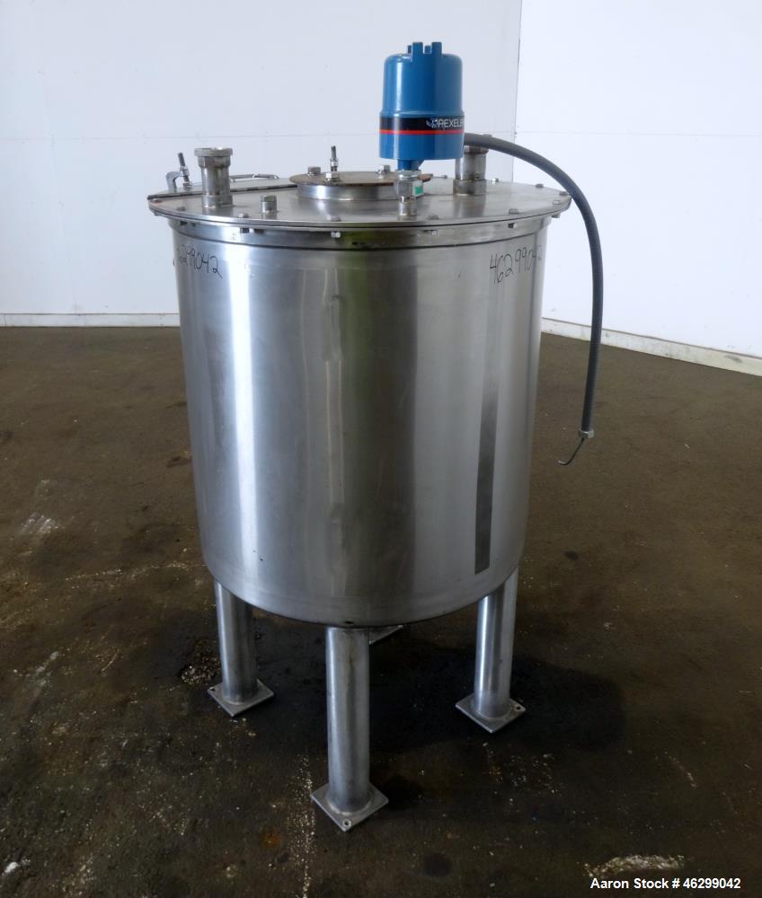 Used Tank, Approximately 80 Gallons, 304 Stainless Steel, Vertical. 30" Diameter x 28" straight side. Bolt-on flat top with 1/3 hinged cover, dished bottom. (4) Sidewall baffles. 1-1/2" Tri-clamp cen...