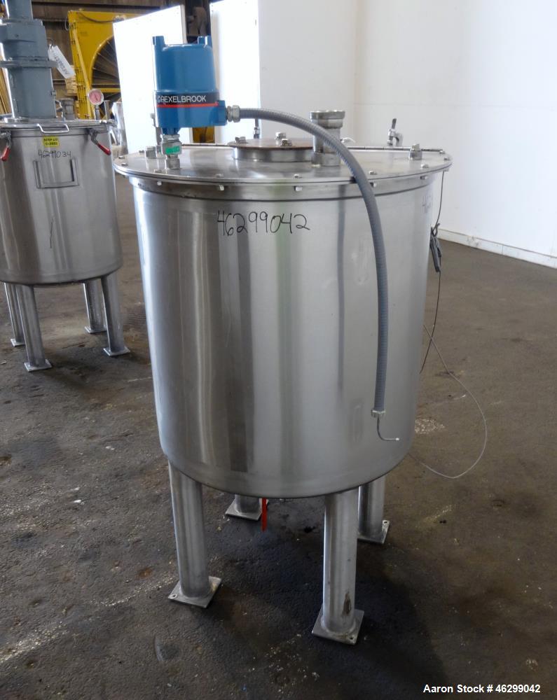 Used Tank, Approximately 80 Gallons, 304 Stainless Steel, Vertical. 30" Diameter x 28" straight side. Bolt-on flat top with 1/3 hinged cover, dished bottom. (4) Sidewall baffles. 1-1/2" Tri-clamp cen...
