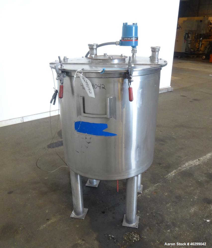 Used Tank, Approximately 80 Gallons, 304 Stainless Steel, Vertical. 30" Diameter x 28" straight side. Bolt-on flat top with 1/3 hinged cover, dished bottom. (4) Sidewall baffles. 1-1/2" Tri-clamp cen...