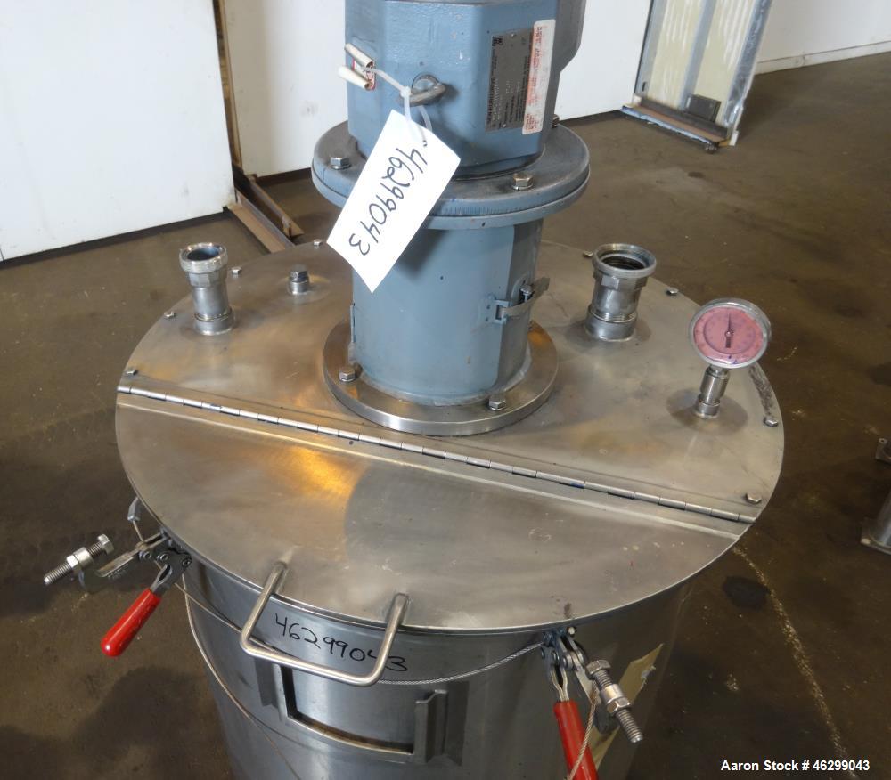 Used Tank, Approximately 80 Gallons, 304 Stainless Steel, Vertical. 30" Diameter x 28" straight side. Bolt-on flat top with 1/3 hinged cover, dished bottom. Top entering agitator, with 2" diameter sh...