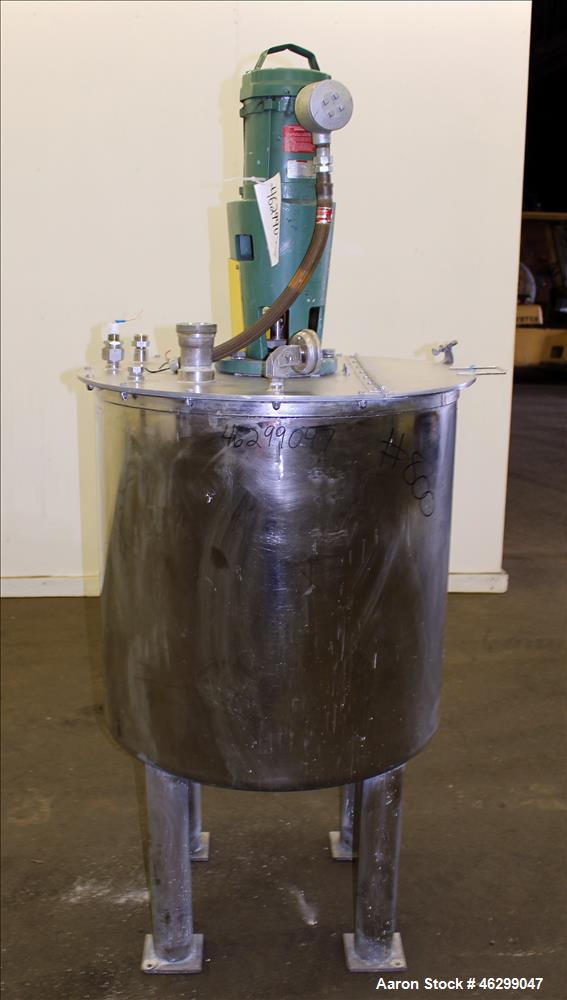Used Tank, Approximately 80 Gallons, 304 Stainless Steel, Vertical. 30" Diameter x 28" straight side. Bolt on flat top with 1/3 hinged cover, dished bottom. Top entering Lightnin agitator model XJC-3...