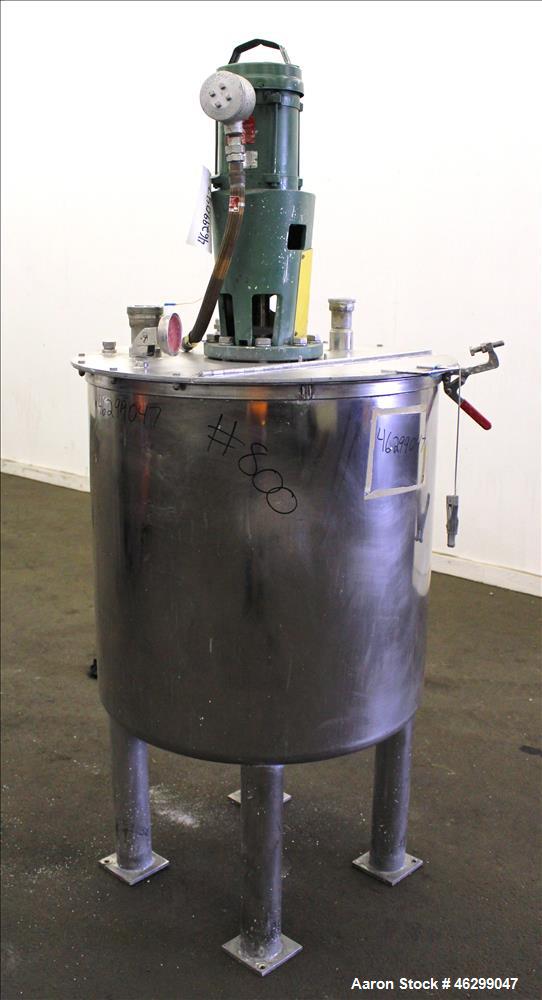 Used Tank, Approximately 80 Gallons, 304 Stainless Steel, Vertical. 30" Diameter x 28" straight side. Bolt on flat top with 1/3 hinged cover, dished bottom. Top entering Lightnin agitator model XJC-3...