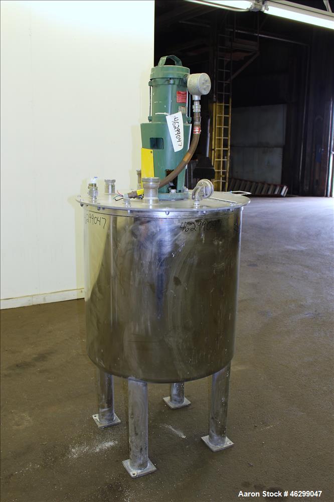 Used Tank, Approximately 80 Gallons, 304 Stainless Steel, Vertical. 30" Diameter x 28" straight side. Bolt on flat top with 1/3 hinged cover, dished bottom. Top entering Lightnin agitator model XJC-3...