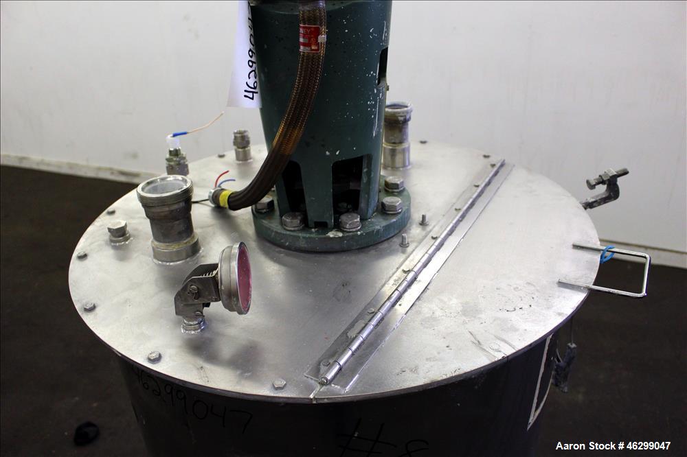 Used Tank, Approximately 80 Gallons, 304 Stainless Steel, Vertical. 30" Diameter x 28" straight side. Bolt on flat top with 1/3 hinged cover, dished bottom. Top entering Lightnin agitator model XJC-3...