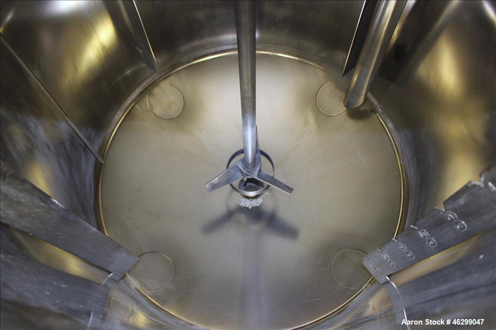 Used Tank, Approximately 80 Gallons, 304 Stainless Steel, Vertical. 30" Diameter x 28" straight side. Bolt on flat top with 1/3 hinged cover, dished bottom. Top entering Lightnin agitator model XJC-3...