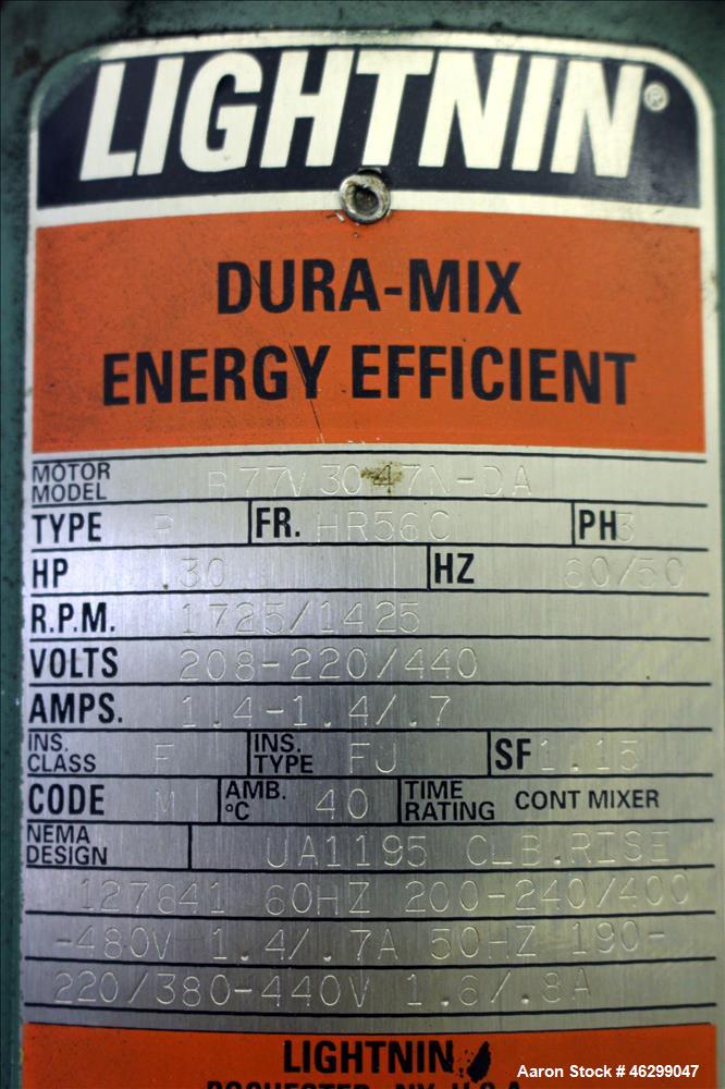 Used Tank, Approximately 80 Gallons, 304 Stainless Steel, Vertical. 30" Diameter x 28" straight side. Bolt on flat top with 1/3 hinged cover, dished bottom. Top entering Lightnin agitator model XJC-3...